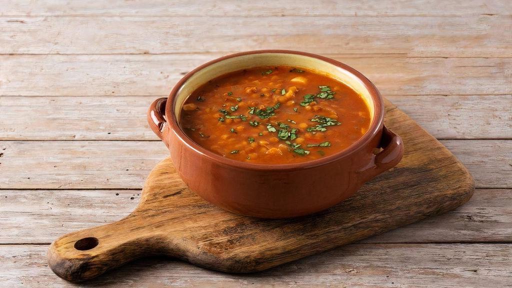 Red Lentil Soup · Lentil soup is a soup with lentils as its main ingredient; it may be vegetarian or include meat, and may use brown, red, yellow, green or black lentils, with or without the husk. Dehulled yellow and red lentils disintegrate in cooking, making a thick soup.