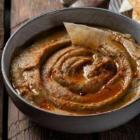 Baba Ghanoush Small · Baba ghanoush is a Levantine appetizer consisting of finely chopped roasted eggplant, olive ...