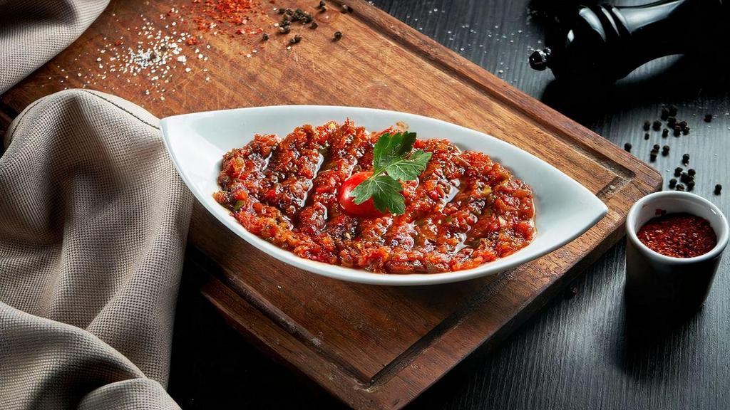 Spicy Ezme Small · Spicy Ezme is a classic Turkish sauce, condiment and appetizer that’s usually served on the side of kebabs with some fresh bread.