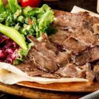 Lamb Gyro Plate Small · Doner kebab is a type of Turkish kebab, made of meat cooked on a vertical rotisserie. Season...
