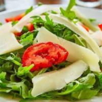 Arugula Salad · Tomatoes, balsamic, shaved parmesiano.