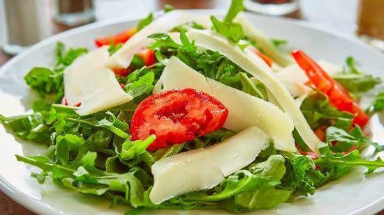 Arugula Salad · Tomatoes, balsamic, shaved parmesiano.