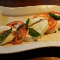 Caprise · Served with fries. Breaded eggplant, fresh mozzarella, spinach, basil and tomato.