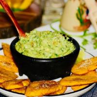 Homemade Guacamole With Smashed Plantain ( Tostones ) · Guacamole made from the scratch, mixed with diced onions, diced tomatoes, cilantro, lime and...