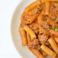 Rigatoni With Sausage · Peas, fresh Tomatoes and a touch of Cream