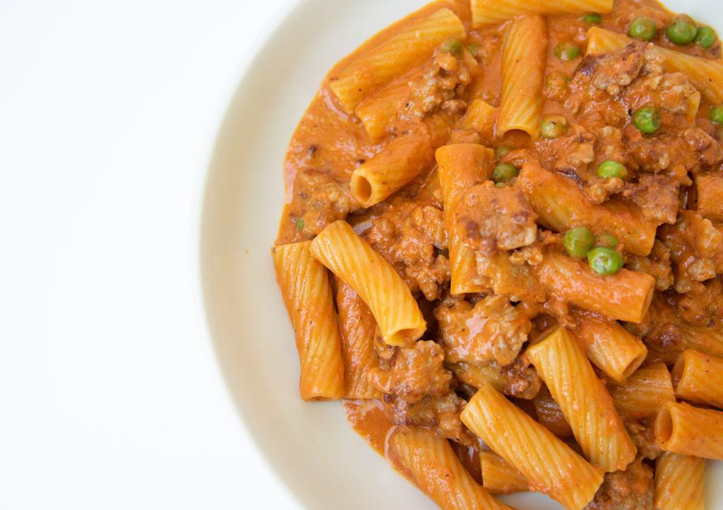 Rigatoni With Sausage · Peas, fresh Tomatoes and a touch of Cream