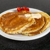 Buttermilk Pancakes · Served with syrup and butter.