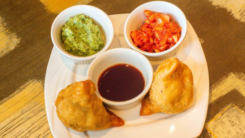 Samosa Vegetable (2 Pc) · Vegetarian. Turnover filled with mildly spiced potato and peas.