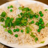 Rice Pulao · Lightly fried rice with onions, bell peppers, tomatoes, peas and nuts.