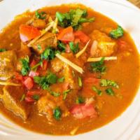 Lamb Curry · Tender pieces of lamb cooked with herbs and spices in a mild sauce.