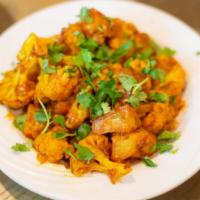 Alu Gobi · Fresh cauliflower and potato cooked with onions, tomato, ginger, garlic, and mild spice.