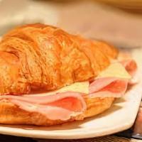 Jamón Y Queso Croissant · Latino Heritage with Delicioso Smoked Ham accompanied with Swiss cheese, lettuce, tomato, an...