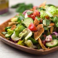 Fattoush Salad · Fried pita bread, cucumbers, tomatoes, green peppers, romaine lettuce, onions and virgin oli...