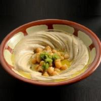Hummus · Ground chickpeas, tahini souse, lemon juice and virgin olive oil.