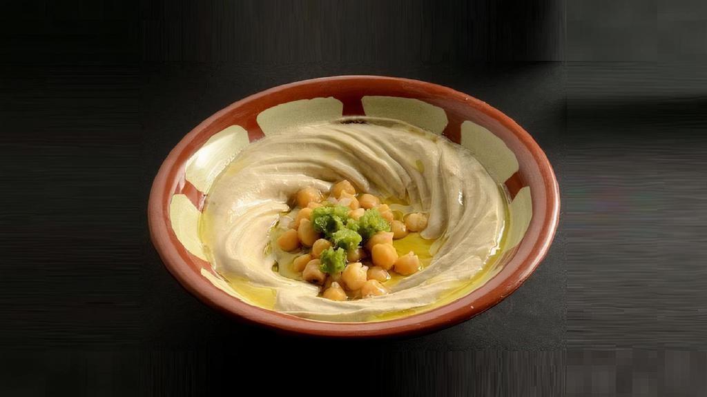 Hummus · Ground chickpeas, tahini souse, lemon juice and virgin olive oil.