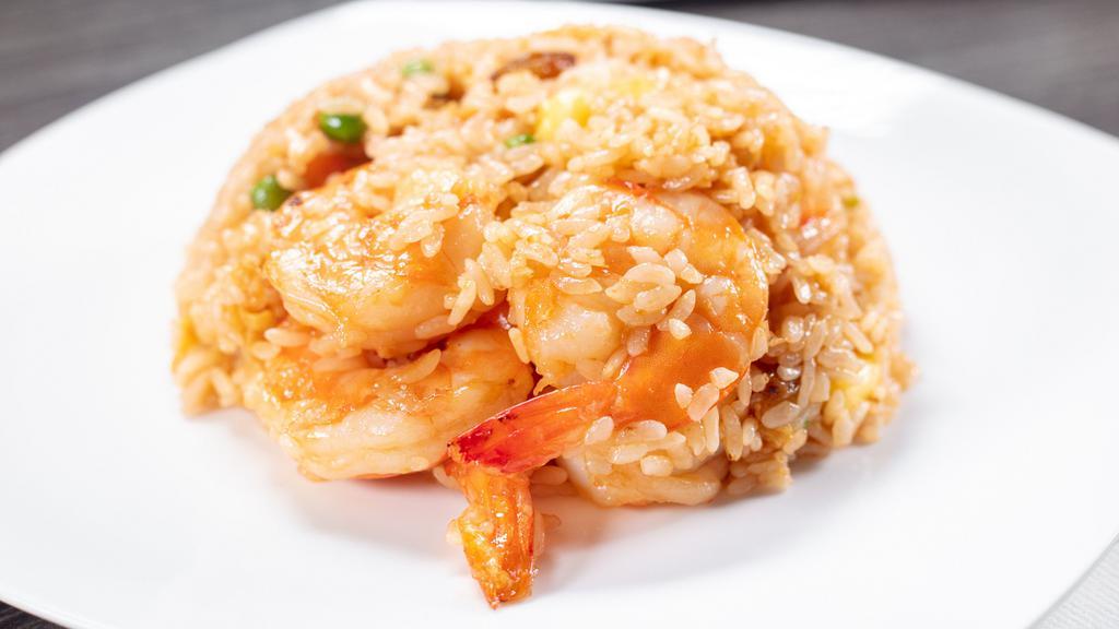 Pineapple Fried Rice · Onion, carrot bean, dry grape, and pineapple.