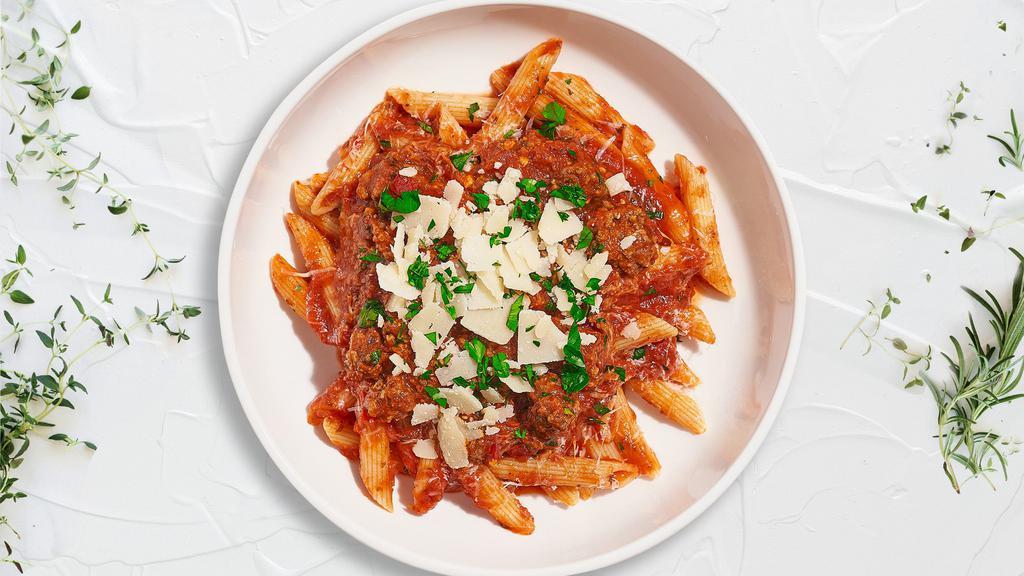So It Vegan Bolognese Gf Penne · (Gluten Free) Fresh penne pasta cooked in a meaty bolognese sauce and topped with black pepper, parsley, and parmesan.