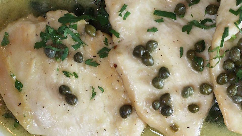 Veal Piccata · Sautéed in white wine and butter sauce with a whisper of lemon over spinach.