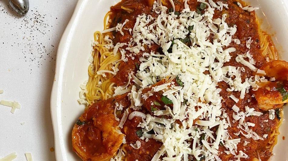 Shrimp Parmigiana · Lightly breaded, sautéed, and topped with mozzarella in a delicious marinara sauce choice of spaghetti, penne or salad.