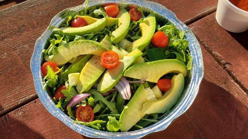 Avocado And Arugula Salad · Tomato, cucumber, red onion, avocado, arugula with homemade lime cilantro dressing.