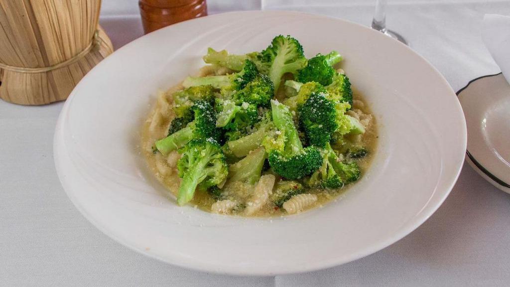 Broccatelli · Homemade cavatelli sautéed with broccoli, garlic, virgin olive oil, and tossed with parmigiano cheese.