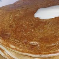 Short Stack Pancakes · Two large pancakes served with side of maple syrup and butter.