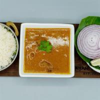 Goat Curry · Cubes of goat cooked in onion and tomato sauce with traditional indian curry.