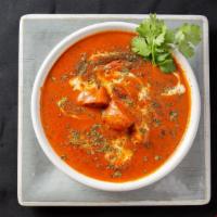 Chicken Tikka Masala · Cubes of chicken roasted in clay oven cooked with mild spiced creamy tomato gravy.