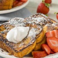 Strawberry Cream Cheese French Toast · 3 slices of French Toast with strawberry cream cheese and topped with fresh strawberries.