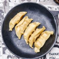 Homemade Steamed Vegetable Gyoza · 5 pieces of homemade steamed spinach dumplings.
