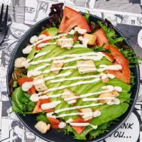 Roasted Sesame Avocado Salad · Spring mix salad with crunchy garlic croutons, avocado, tomatoes and candied almonds dressed...