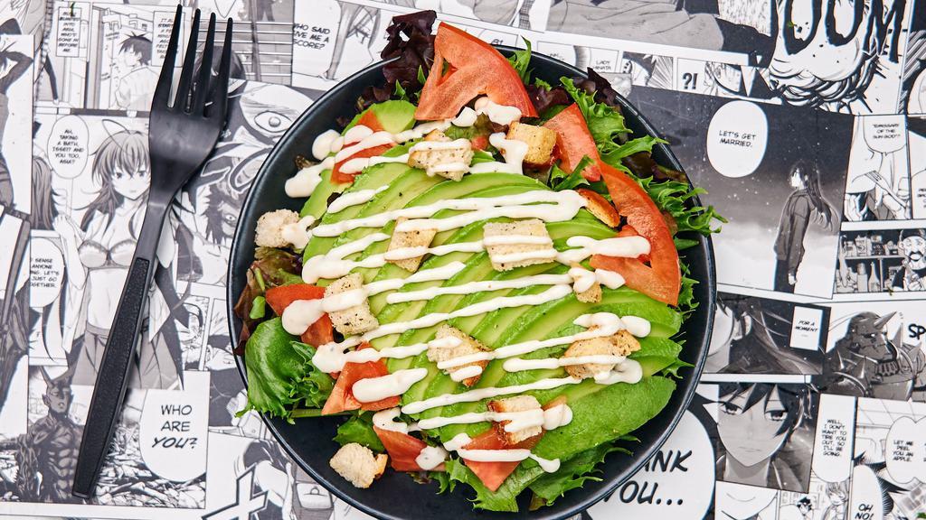 Roasted Sesame Avocado Salad · Spring mix salad with crunchy garlic croutons, avocado, tomatoes and candied almonds dressed with a housemade roasted sesame dressing.