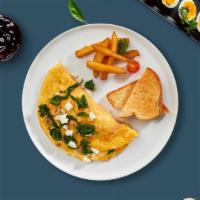 Greek Omelette · Three organic eggs, feta cheese, kalamata olives, spinach and tomatoes.