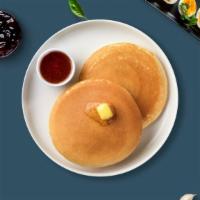 Buttermilk Pancakes · Two pancakes homemade from our secret recipe.