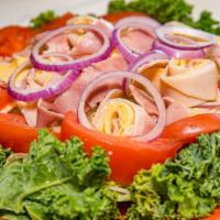 Chef Salad  · Turkey, ham, American, & Swiss cheese on a bed of lettuce and tomato.