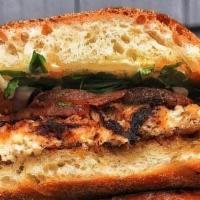 Famous Shack Fish Sandwich · Blackened pan seared grouper served with arugula, tomato, red onion and mayo on a toasted ci...