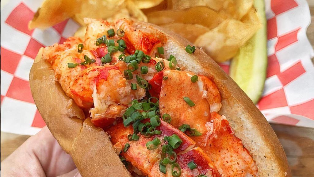 Lobster Roll Platter · quarter pound of fresh lobster meat on a toasted new England split bun. Rolls are served w/ homemade coleslaw, pickles and choice of house salad or home-made potato chips. * Gluten free buns are available.