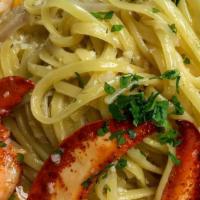 Linguini In Garlic Sauce · linguini, lobster claws, shrimp, and P.E.I. mussels tossed in a garlic butter sauce. yum..