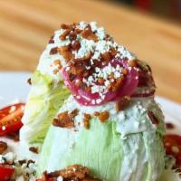 Wedge Salad · Iceberg lettuce, crumbled blue cheese, bacon cherry tomatoes, pickled red onions and side of...
