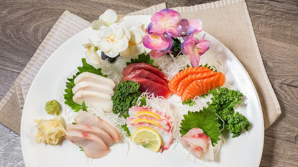 Sashimi Deluxe · 18 pieces of sashimi. Served with miso soup or salad.