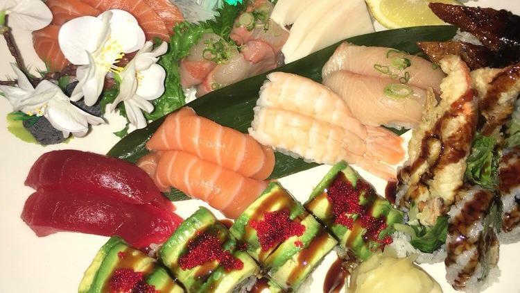 Sashimi Supreme · 20 pieces of sashimi including two pieces of toro. Served with miso soup or salad.