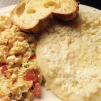 Arroz Con Huevos Paricos · Rice with scrambled eggs.
