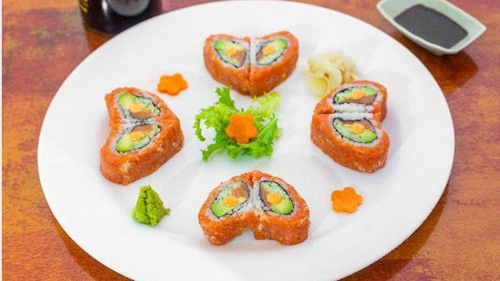 Sweet Heart Roll · Salmon, avocado, cucumber and tempura crunchy inside with spicy tuna outside. Served with spicy mayo and special sauce.