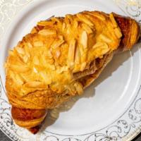Almond Croissant · Made with European butter of the highest quality. Filled with almond cream, topped with conf...