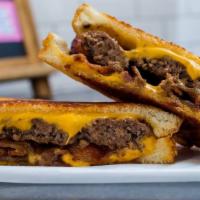 Grilled Cheese Burger · Our Single Burger inside our Grilled Cheese
