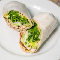Grilled Chicken Avocado Wrap · Baby greens, Pepper Jack cheese and Caesar dressing.