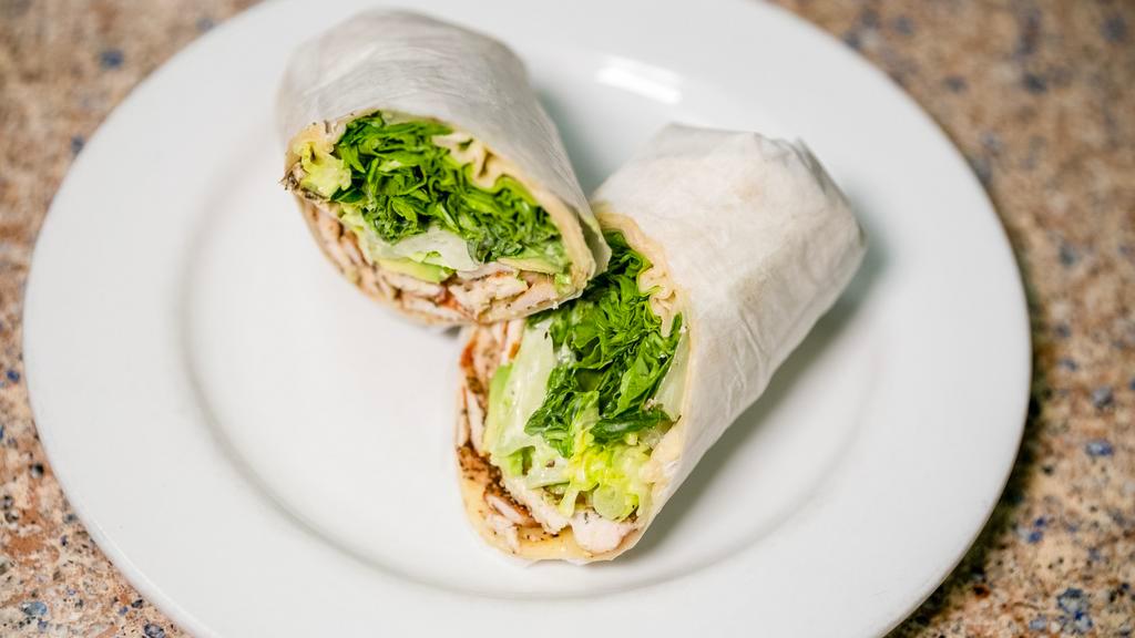 Grilled Chicken Avocado Wrap · Baby greens, Pepper Jack cheese and Caesar dressing.