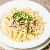 Penne Alfredo Sauce With Grilled Chicken · In white cream sauce.