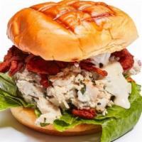 Chicken Salad Sandwich · Herb chicken salad, spicy fried onion strings, black pepper aioli, and romaine lettuce on a ...