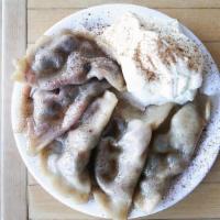 Blueberry(5) · 5 blueberry pierogies boiled and tossed in baba's sweet butter and cinnamon. Comes with whip...